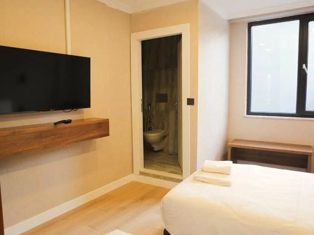 Twin Room: television console and window